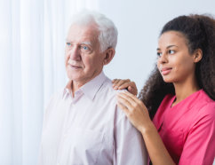 caregiver showing care for a senior man